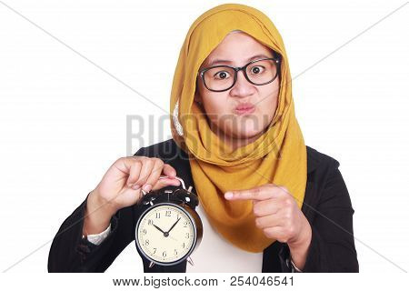 Young Businesswoman Pointing At Clock, Angry Expression