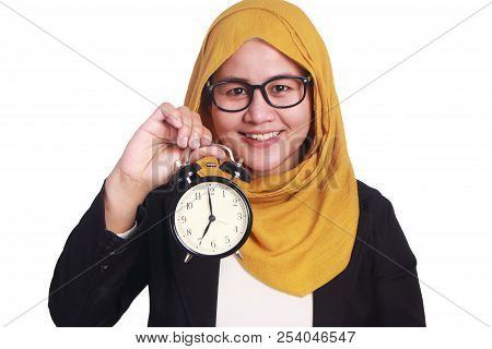 Young Businesswoman Holding A Clock