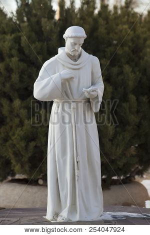 Statue Of San Francisco De Asis In Fornt Of The Taos, New Mexico In Front Of His Namesake Church.