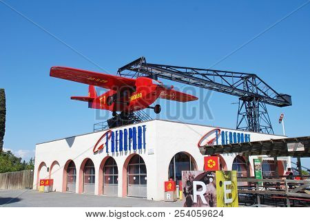 BARCELONA, SPAIN - APRIL 18, 2018: The iconic El Avio aeroplane ride at the Tibidabo Amusement Park on Mount Tibidabo. The ride has been operating since 1928.