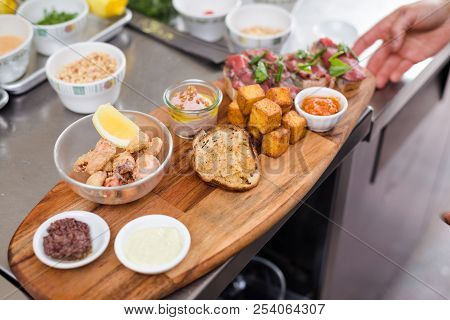 An Artisan Appetizer Board With Frito Misto.