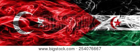 Turkey Vs Sahrawi Smoke Flags Placed Side By Side. Turkish And Sahrawi Flag Together