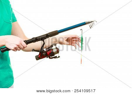 Spinning Sport Equipment Concept. Person Holding Fishing Rod With Float And Waggler With Line.