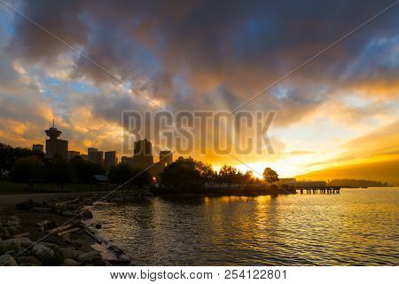 Sunset Over Vancouver British Columbia Canada City Skyline By Crab Park At Portside