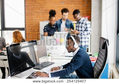 Young African Programmer Working On Personal Computer