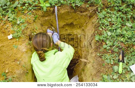 Woman Ecologist Taking Samples Of A Soil