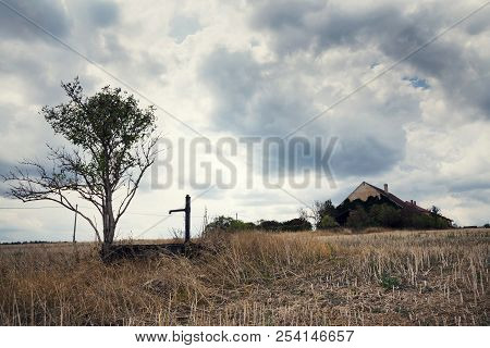 Old Pump With Dry Soil, Dramatic Cloudy Sky, Water Shortage