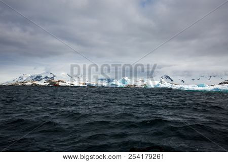 Ice In The Antarctica With Iceberg In The Ocean