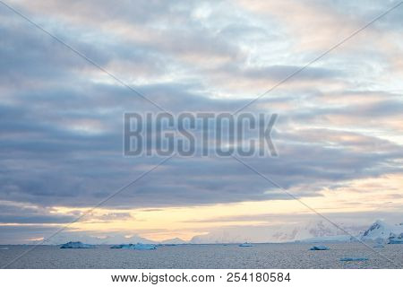 Ice In The Antarctica With Iceberg In The Ocean