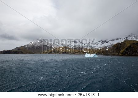 Ice In The Antarctica With Iceberg In The Ocean