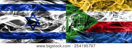 Israel Vs Comoros Smoke Flags Placed Side By Side. Israeli And Comoros Flag Together