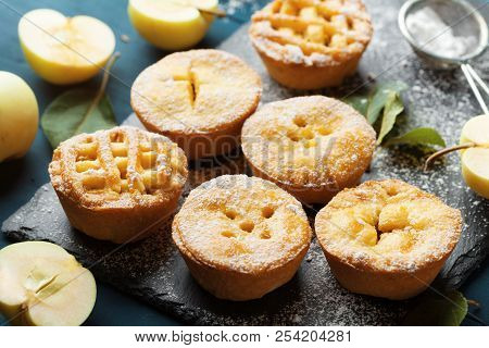 Pastry Dessert From Mini Apple Pies Decorated Sugar Powder On Black Slate Board.
