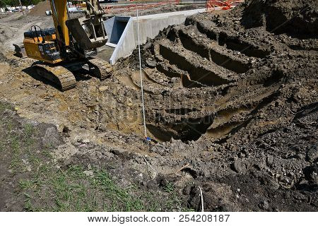 Fargo, North Dakota, August 14, 2018: Founded In 1925, The Cat Excavator Moving A Scoop Of Earth Is 