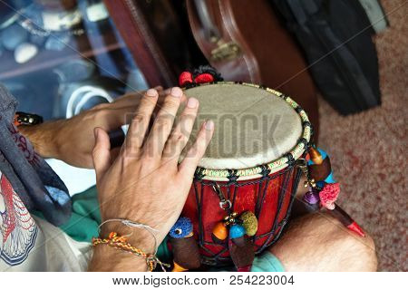 Hands Of Man Playing African Drum Or Djembe Inside A Music Shop. Chiang Mai, Thailand.