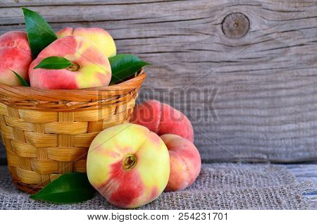 Chinese Flat Donut Peaches In The Basket On On Old Wooden Table Also Known As Saturn Donut, Doughnut