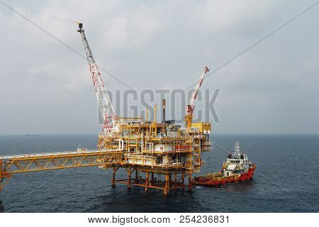 Supply Boat Transfer Cargo To Oil And Gas Industry And Moving Cargo From The Boat To The Platform