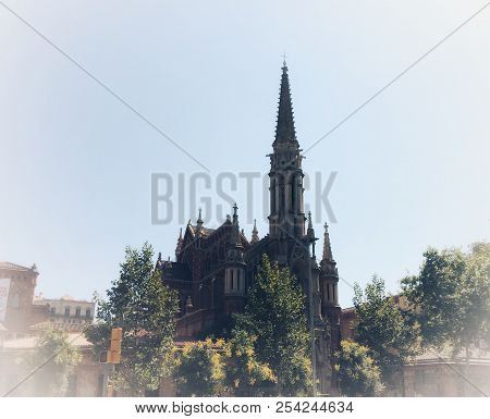 Gothic Cathedral With A Spire And A Tower Surrounded By Trees, Vignetting