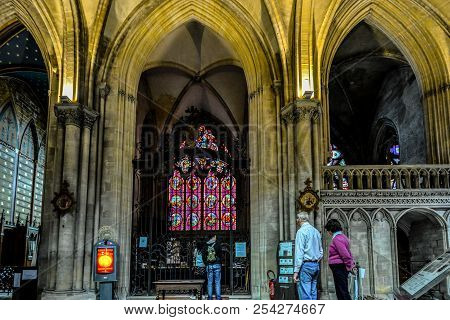 Bayeux, France - September 19 2017: Tourists Near The Stained Glass Window In A Small Chapel Inside 