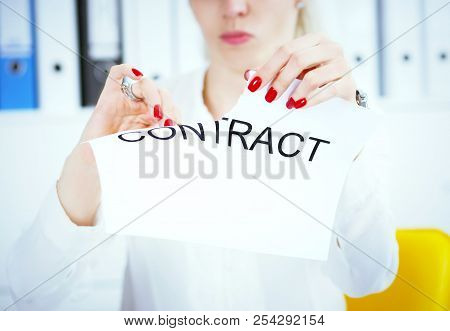 Hands Of Female Medicine Doctor Ripping Contract. Photo With Depth Of Field.