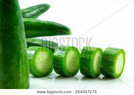 Close Up Snake Gourd Slice Isolated On White Background