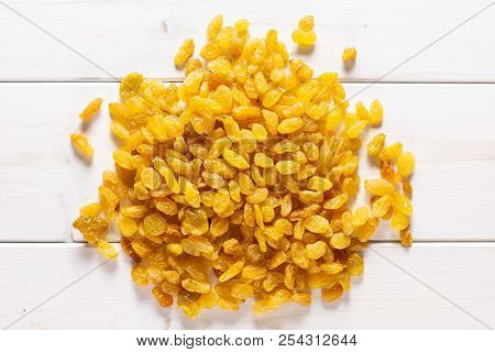 Lot Of Whole Dry Golden Raisins Sultana Variety Heap Flatlay On Grey Wood