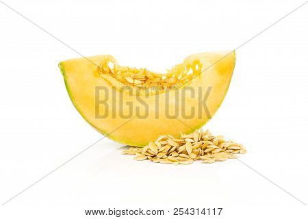 One Slice Of Fresh Melon Cantaloupe Variety With Seeds Around Isolated On White Background