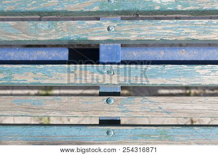 Fragment Of A Old Wooden Bench. Clopse-up.