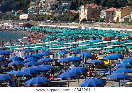 Levanto, Italy, August 15, 2017 - Green And Blue Beach Umbrellas In A Bathhouse In Ligurian Riviera,