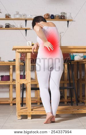 Back Pain, Kidney Inflammation, Woman Suffering From Backache At Home, Painful Area Highlighted In R
