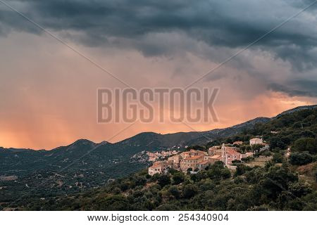 Storm Clouds At Sunrise Over The Mountain Villages Of Costa And Belgodere In The Balagne Region Of C