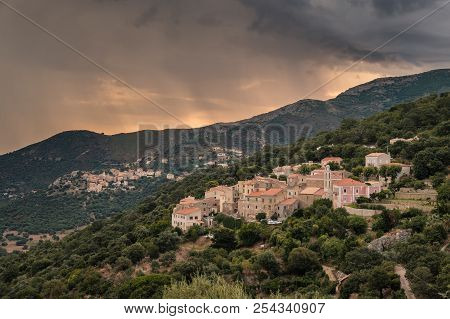 Storm Clouds At Sunrise Over The Mountain Villages Of Costa And Belgodere In The Balagne Region Of C