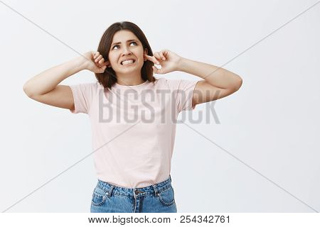 Stupid Neighbor From Upstairs. Portrait Of Pissed And Fed Up Annoyed Attractive Female Brunette Clen