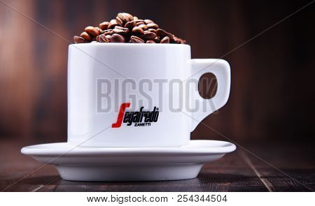 Composition With Cup And Beans Of Segafredo Zanetti Coffee
