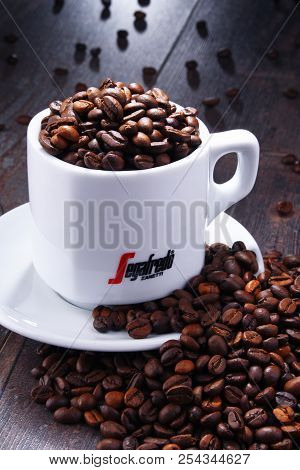 Composition With Cup And Beans Of Segafredo Zanetti Coffee