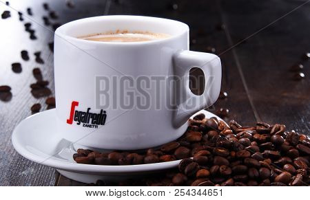 Composition With Cup And Beans Of Segafredo Zanetti Coffee
