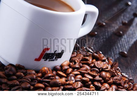 Composition With Cup And Beans Of Segafredo Zanetti Coffee