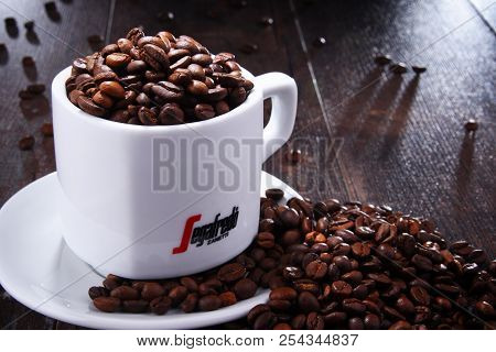Composition With Cup And Beans Of Segafredo Zanetti Coffee