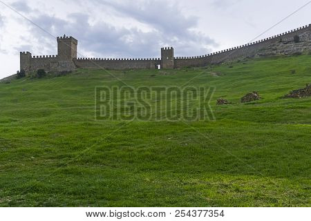 Genoese Fortress In Sudak, Crimea.the Citadel And The Wall Of The Upper Tier Of Defense. Cloudy Day,