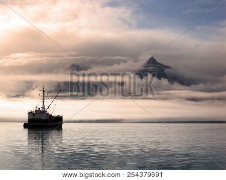 Boat At Rest Surrounded By Sunrise Colors