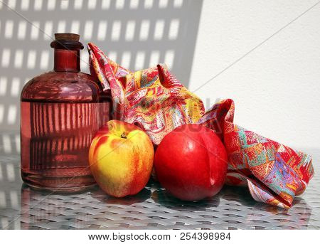Still Life With Fresh Lemonade In Vintage Glass Botlle, Two Ripe Nectarines And Beautiful Napkin Aga