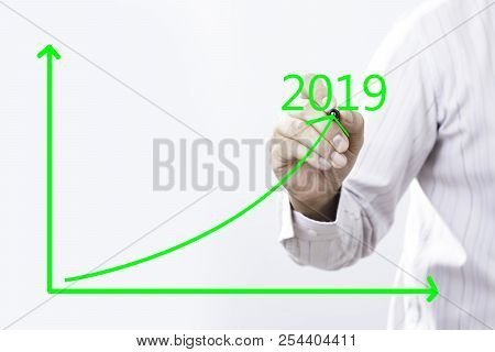 2019 Text And Businessman Hand Point On Virtual Graph Green Line.