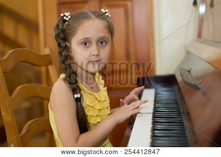 Belarus, Gomel, May 29, 2018. The Kindergarten Is Central. Open Day.child Plays The Piano.preschool 