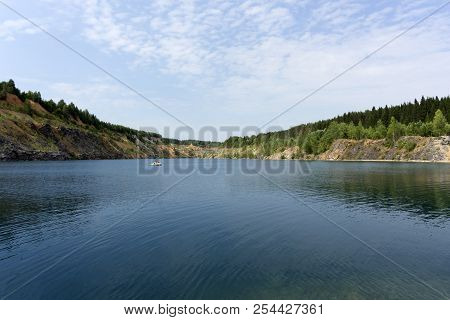 Lake With Blue Water, A Place Of Recreation Formed On The Site Of Old Abandoned Quarry