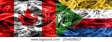 Canada Vs Comoros Smoke Flags Placed Side By Side. Canadian And Comoros Flag Together