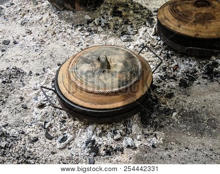 Earthen Pot On Coal In The Street, Trumpet Festival Guca, Serbia.