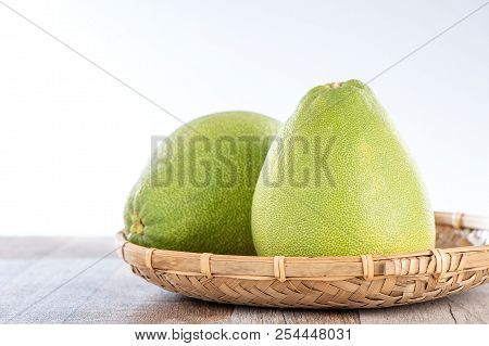 Fresh And Peeled Pomelo(shaddock), Grapefruit With Slices On Wooden Table Background