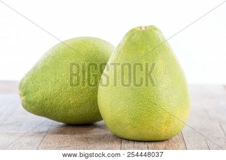Fresh And Peeled Pomelo(shaddock), Grapefruit With Slices On Wooden Table Background