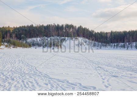 City Ogre, Latvia. Peoples And Old Sand Quarry At City Ogre. Snow And Ice, Nature Photo. Travel Phot
