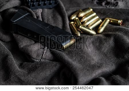 Full Metal Jacket 9Mm Ruger Bullet On Cloth Texture