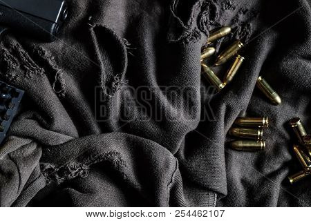 Full Metal Jacket 9Mm Ruger Bullet On Cloth Texture